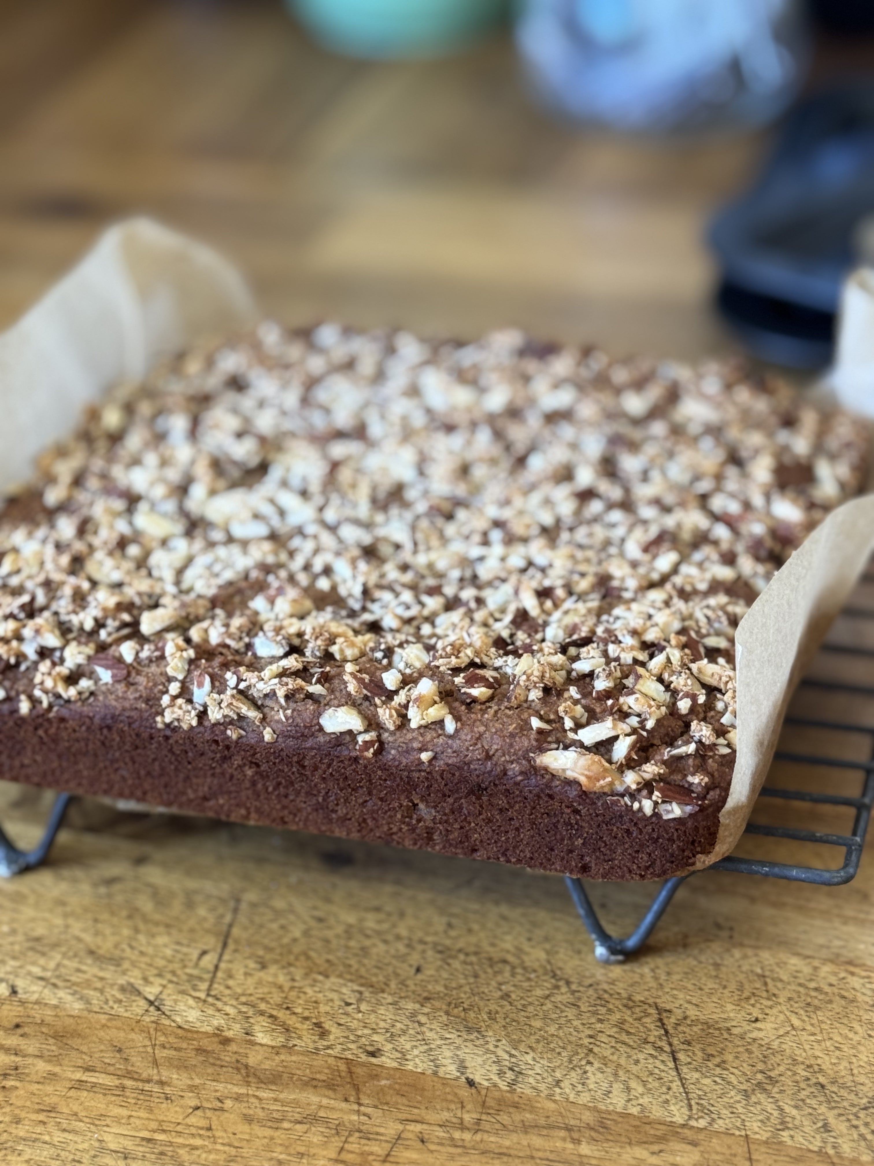Gluten free banana bread with a crunchy top on baking rack, gluten free vegan baking, best gluten free banana bread