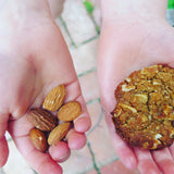 Gluten free ANZAC biscuits, gluten free cookies, gluten free baking with almond, little hands holding gluten free cookie made with almond