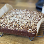 Gluten free banana bread with a crunchy top on baking rack, gluten free vegan baking, best gluten free banana bread