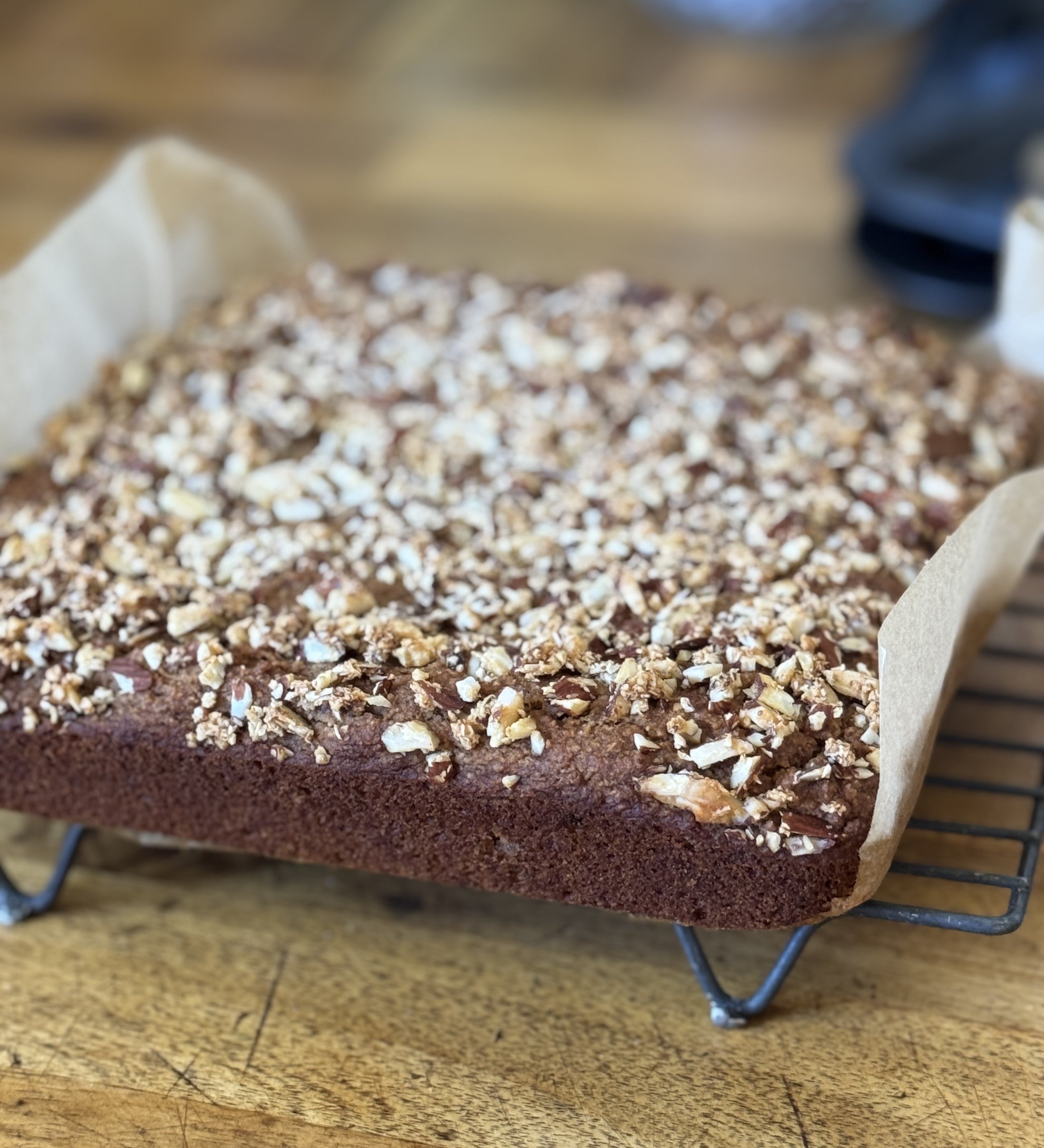 Gluten free banana bread with a crunchy top on baking rack, gluten free vegan baking, best gluten free banana bread