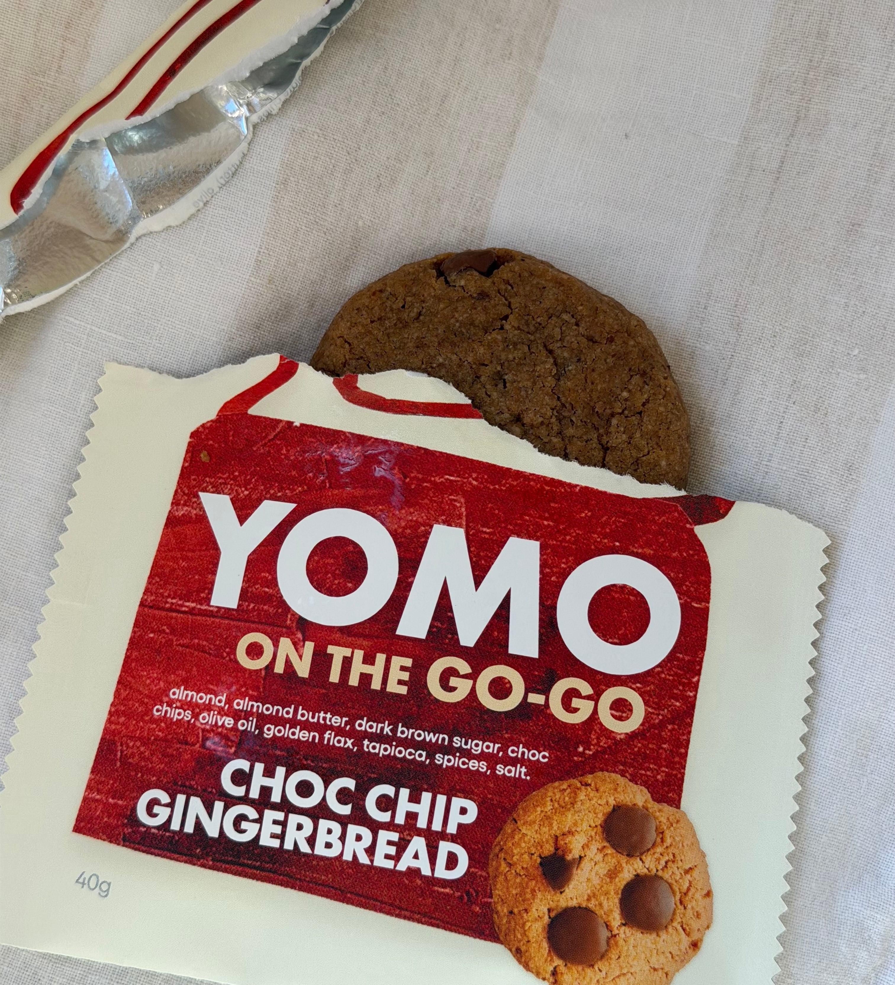 YOMO Choc Chip Gingerbread cookie shown with both cookie and packaging, gluten free and vegan