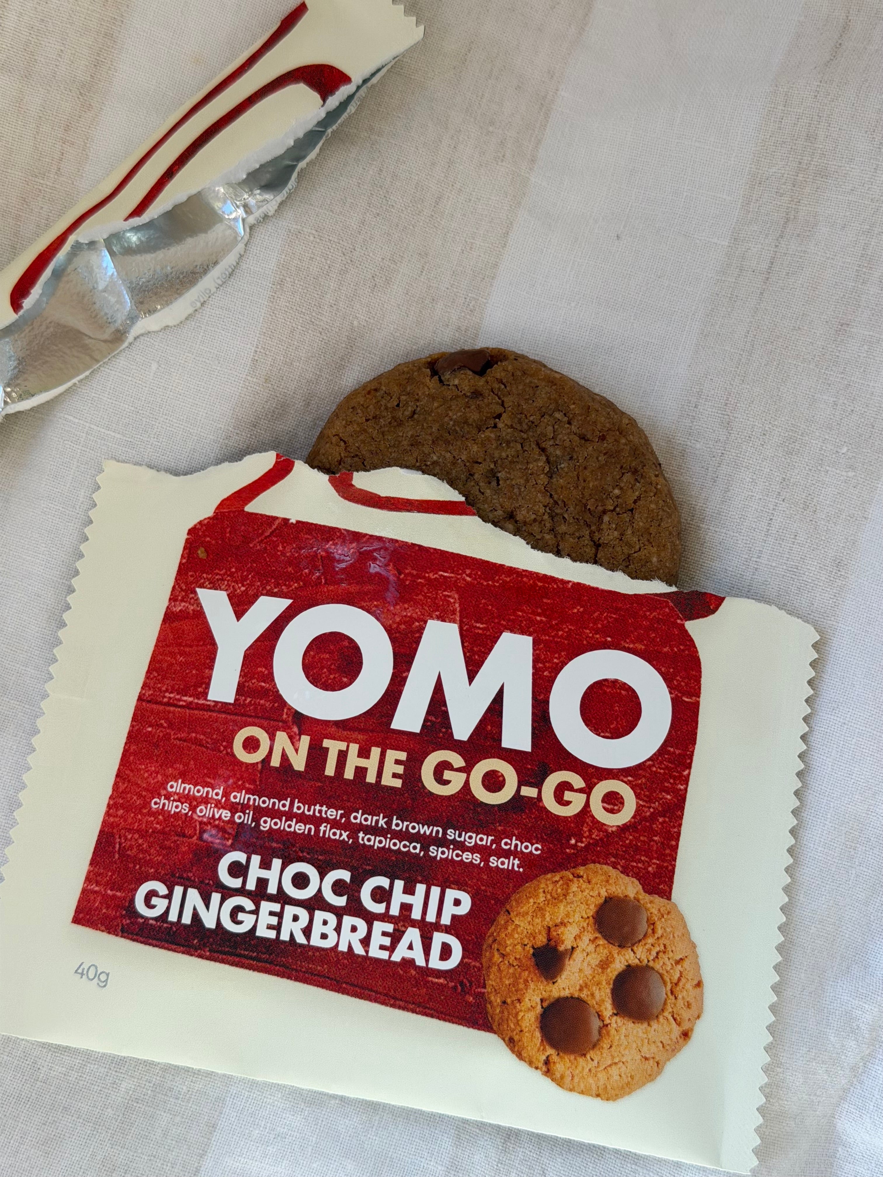 YOMO Choc Chip Gingerbread cookie shown with both cookie and packaging, gluten free and vegan